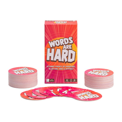 Board game set with 'Words Are Hard' cards and packaging on a white background