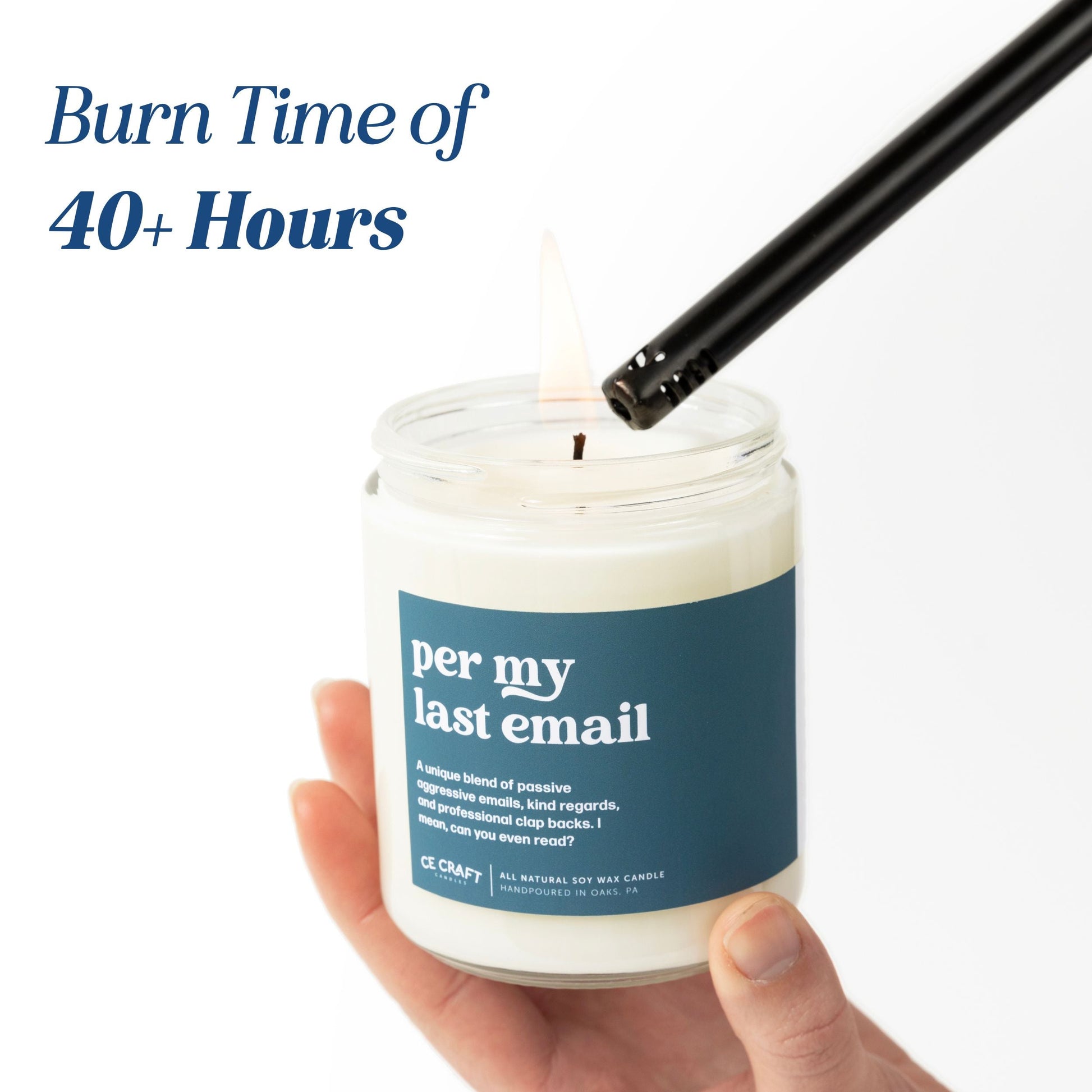 Candle with a label and a hand holding it, with text about burn time.