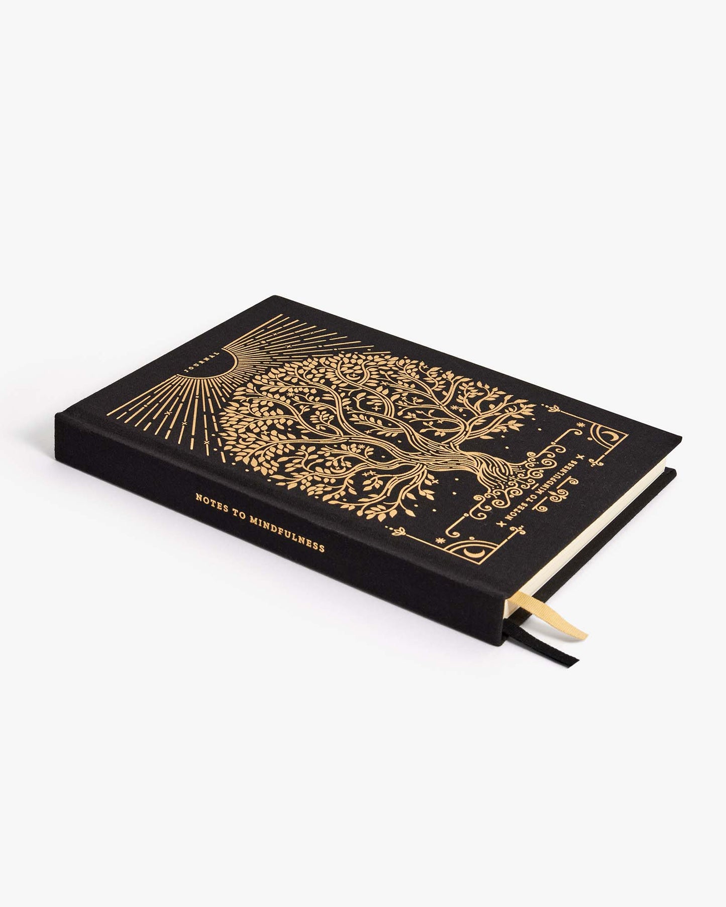 Black notebook with gold tree of life design on a white background