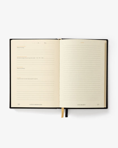 Open notebook with lined pages on a white background