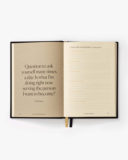 Open notebook with a quote on a white background