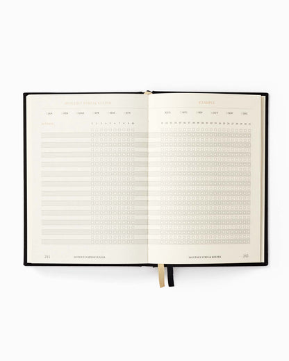 Open planner with daily and weekly schedules on a white background