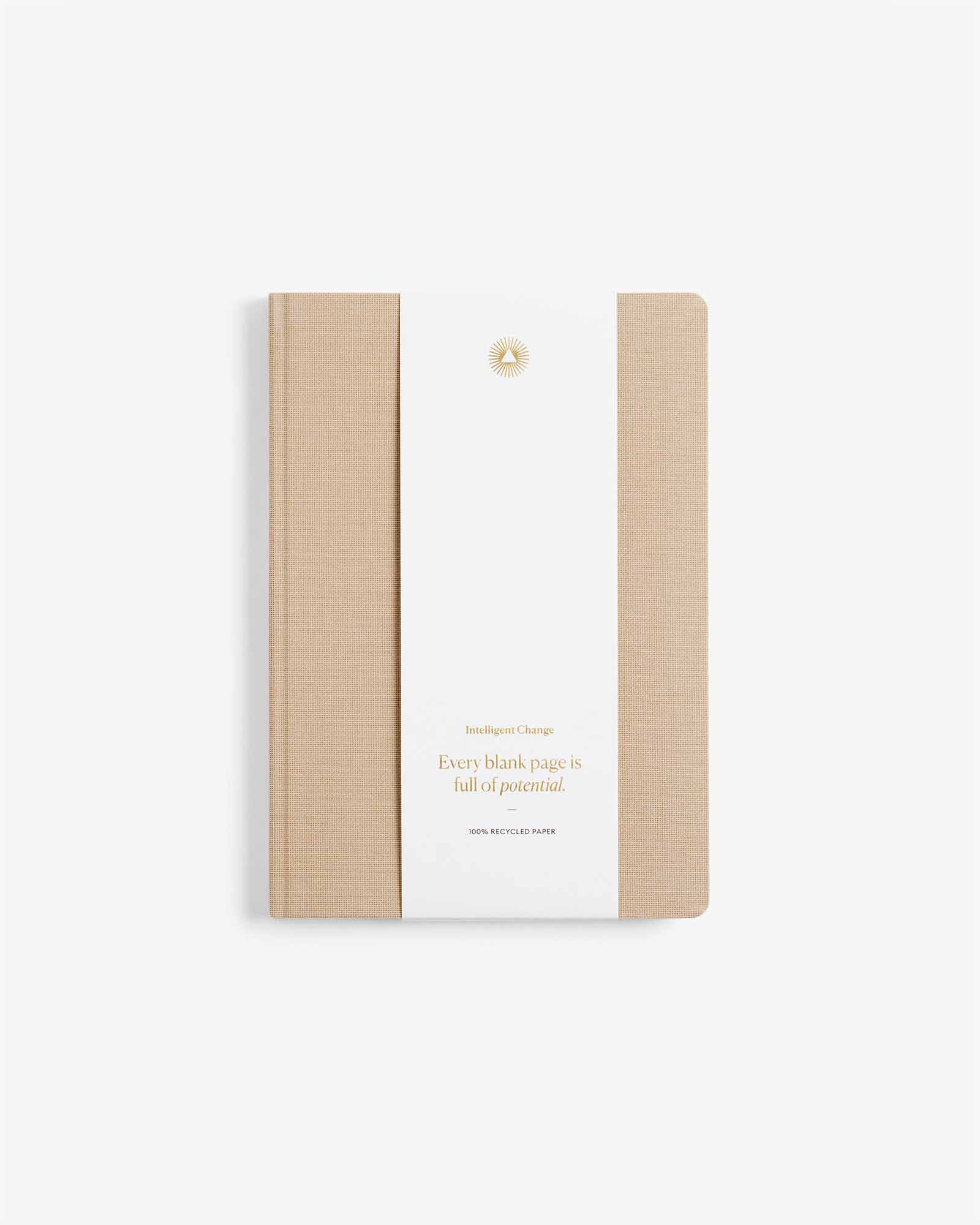 Notebook with beige cover and white back on a light beige background