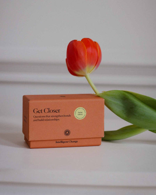 Orange box labeled 'Get Closer' with a red tulip on a light background