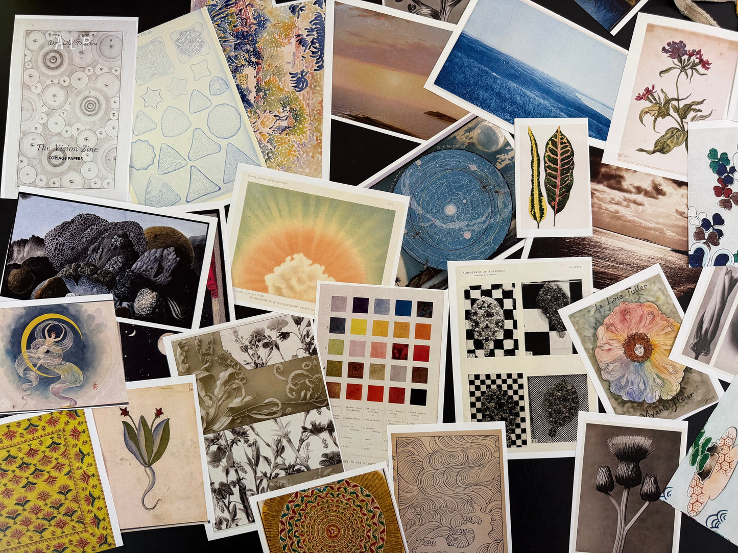 Collection of variously sized and shaped postcards with different designs.