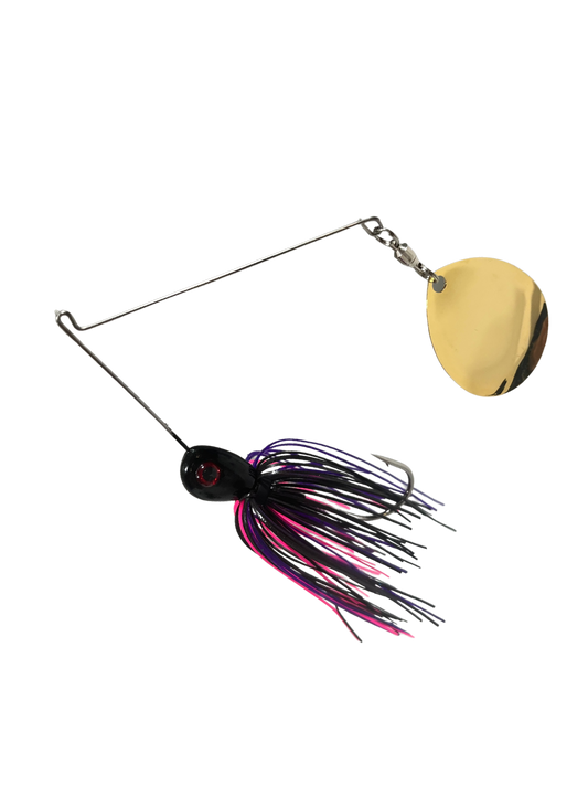 Fishing spinner lure with a gold blade and colorful skirt on a white background