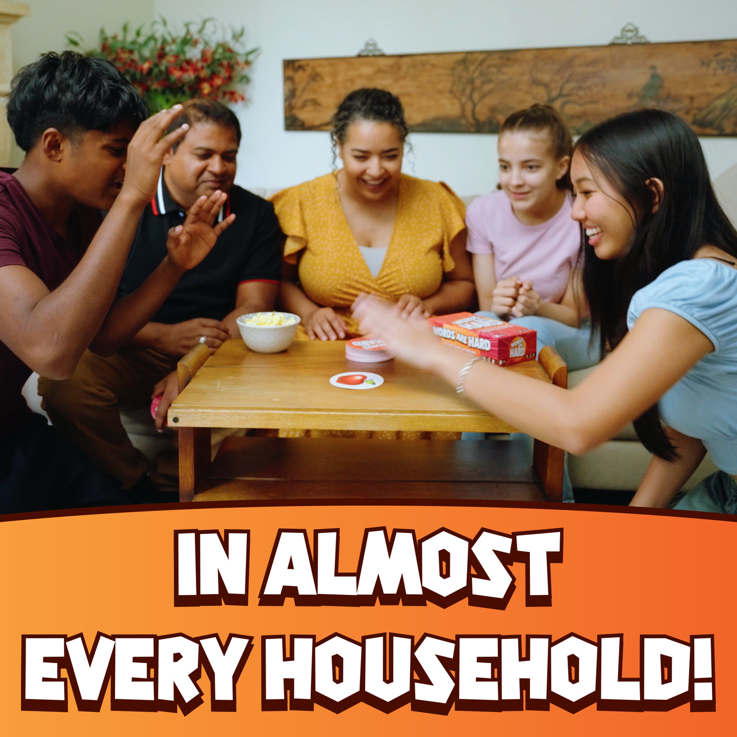 Group of people gathered around a table with text 'IN ALMOST EVERY HOUSEHOLD!'