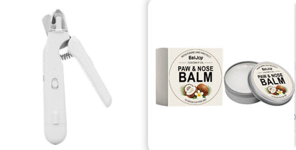 White pet nail clipper and paw and nose balm packaging on a white background